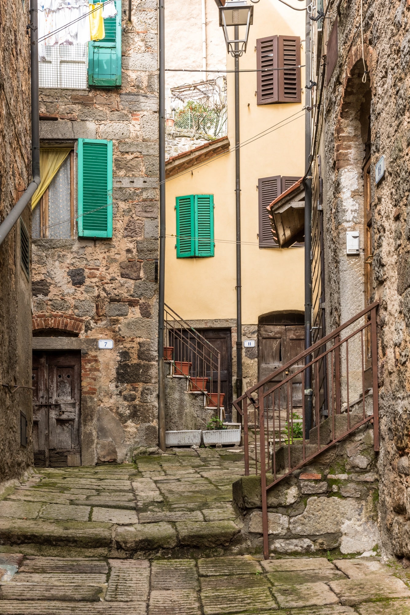 Vertical Shot Old Neighborhood With Ancient Houses Old Staircases Min