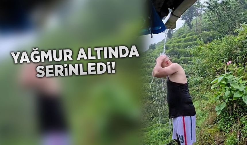 Rize'de vatandaş sağanak altında duş alarak serinledi